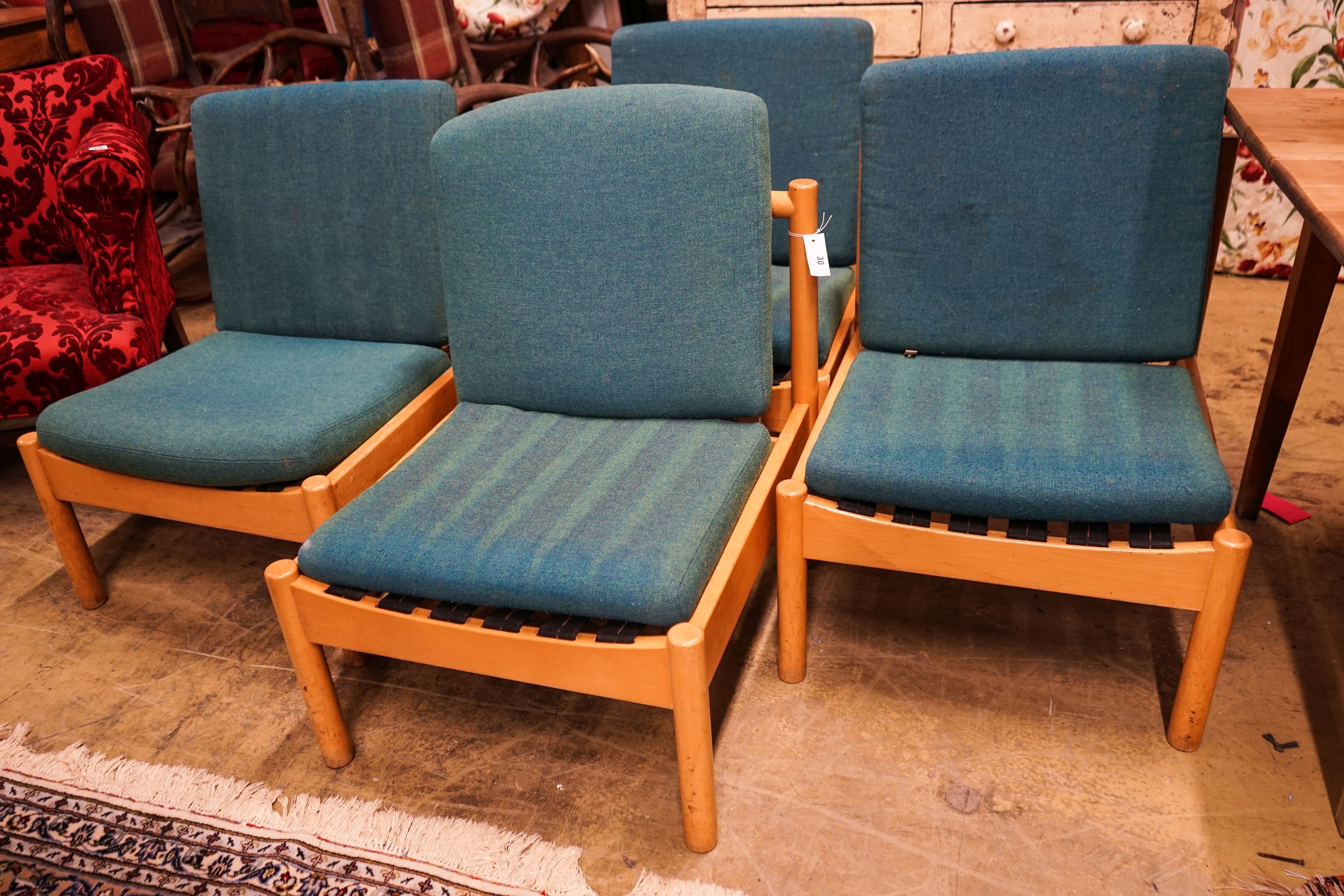 A set of four Ercol pale beech lounge chairs with cushion seats and backs, width 60cm, depth 66cm, height 82cm